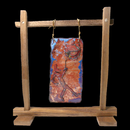 Catching the Sun is a copper relief art creation with a handmade wooden stand for tabletop designs and home decor